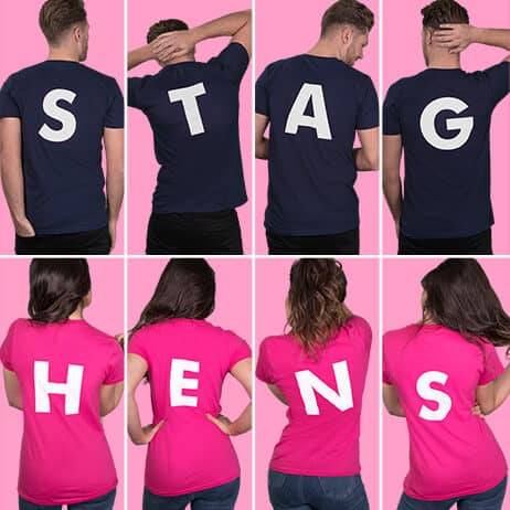 Top row shows examples of back letter extra prints, spelling out STAG. White print on navy t shirts. Bottom row shows hen t shirts from behind with back letters, spelling out HENS. White print on fuchsia lady fit t shirts
