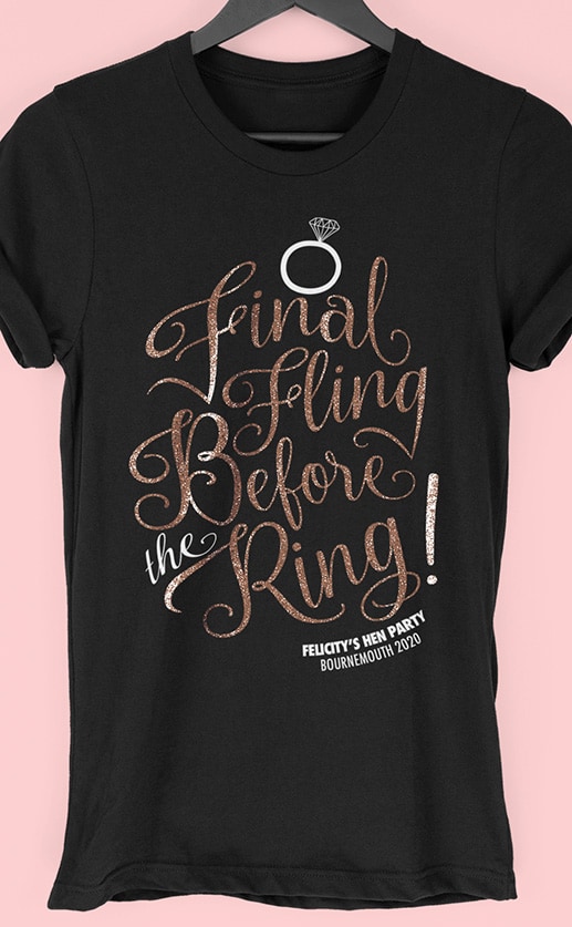 Image to buy product Final Fling Glitter Personalised Hen Party T Shirt. Script lettering in glitter rose gold print with subtext in white on a black t-shirt.
